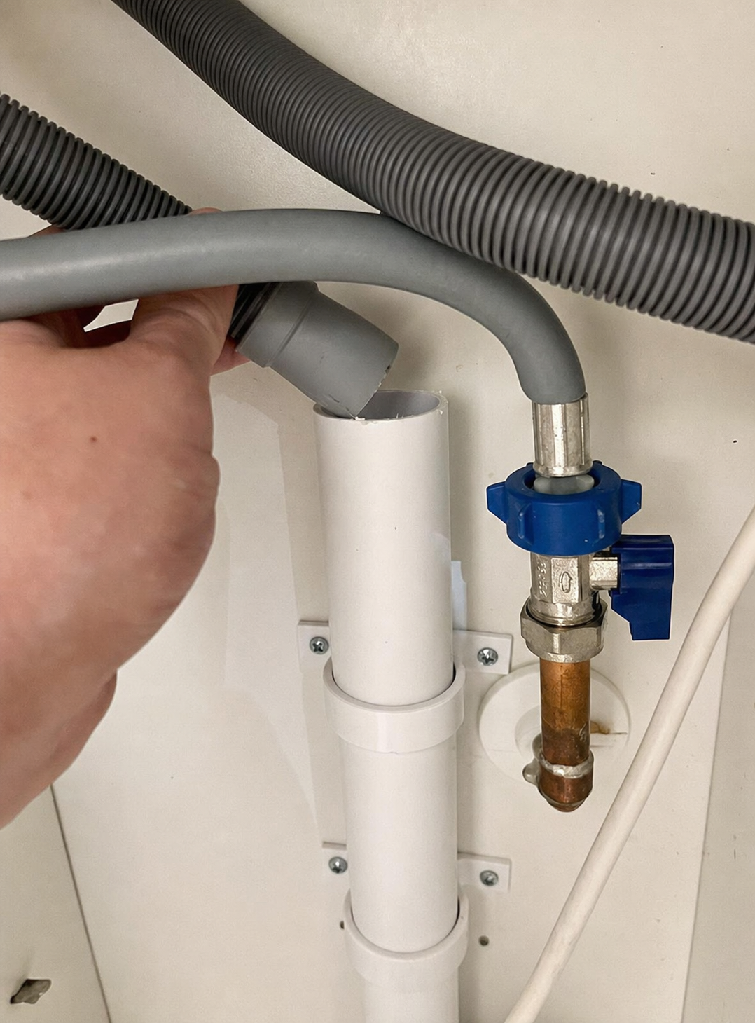 Appliance connection pipework under a kitchen unit — CM Plumbing & Heating, Buckley